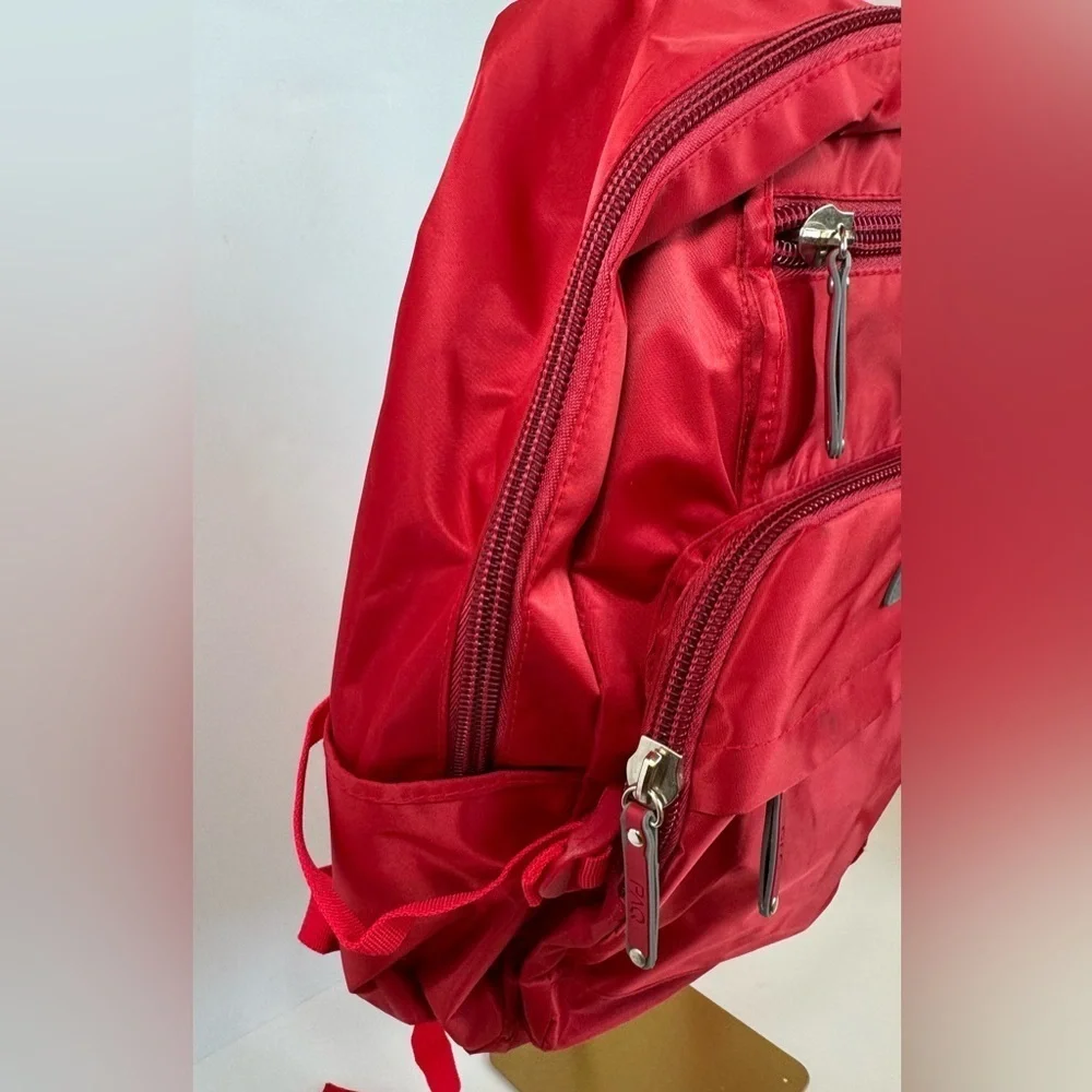PAQ vibrant red backpack in like new condition